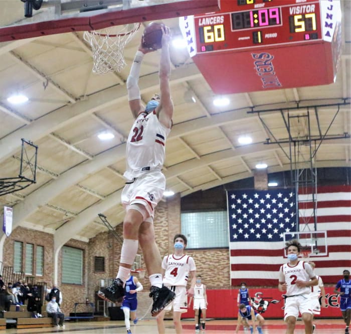 St. John's Northwestern Academies guard Brandin Podziemski throws down a dunk to seal a win over Oak Creek.